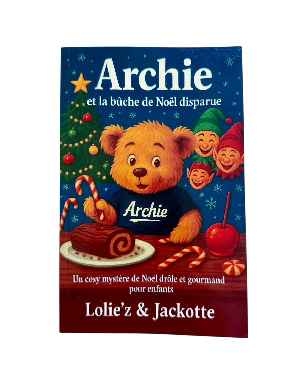 Livre de Noël pour enfant avec Archie, un ours accusé d’avoir mangé la bûche de Noël et bien décidé à trouver le véritable coupable.
