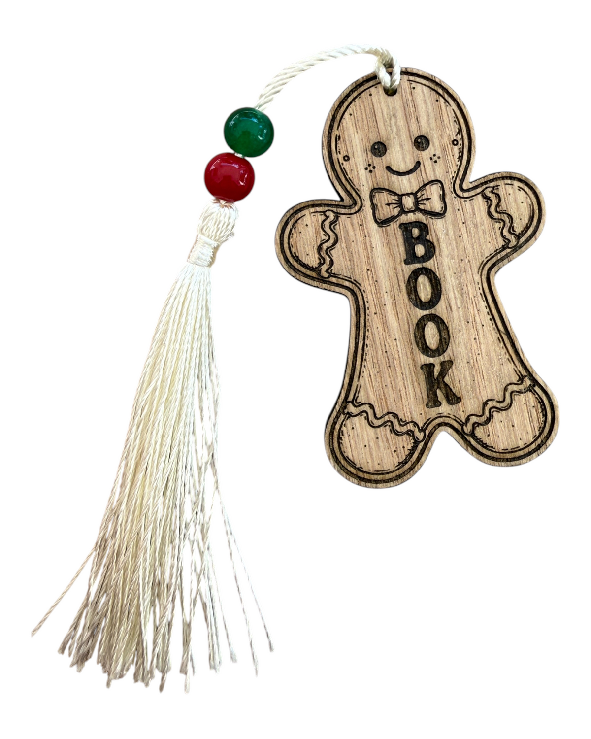 Marque-page GINGERBREAD MAN Lolie’z en bois découpé et gravé, avec inscription BOOK, pompon écru et perles rouge et verte.