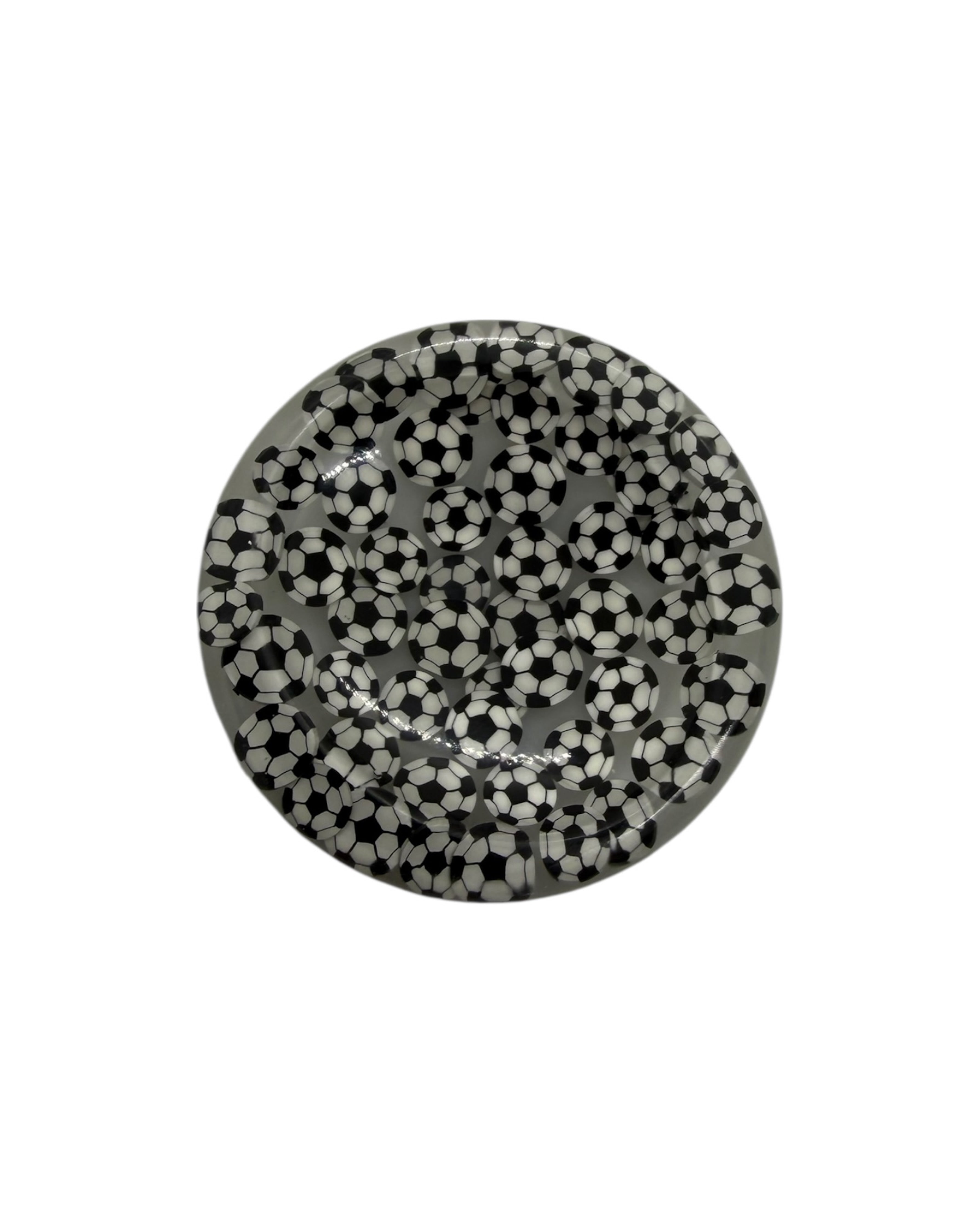 Halo, galet anti-stress rond en résine époxy fait main, à la surface lisse, conçu pour un geste apaisant et répétitif au quotidien.