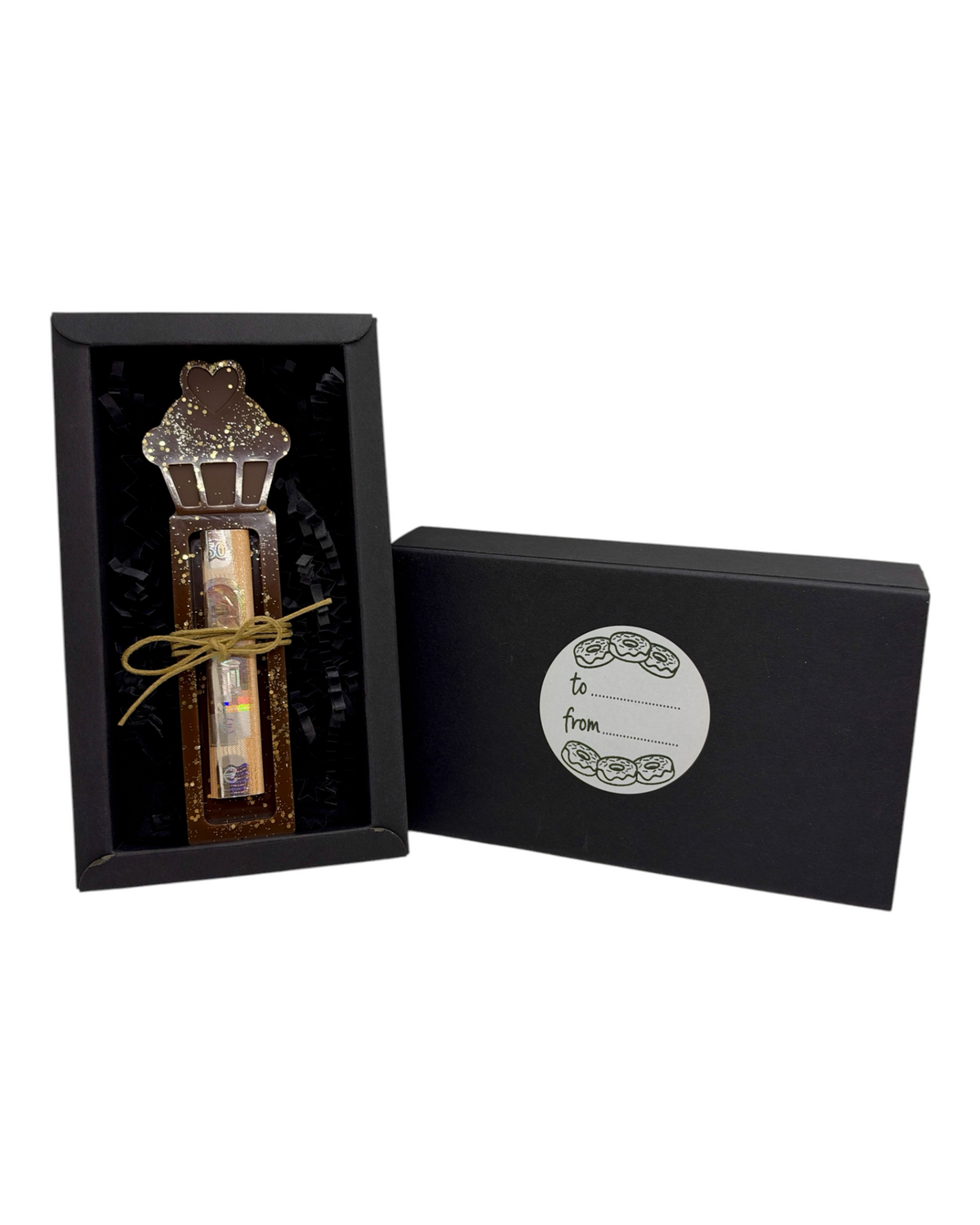 Support à billet de Noël Little Cupcake en forme de gâteau chocolat aux paillettes dorées, présenté dans son coffret noir.