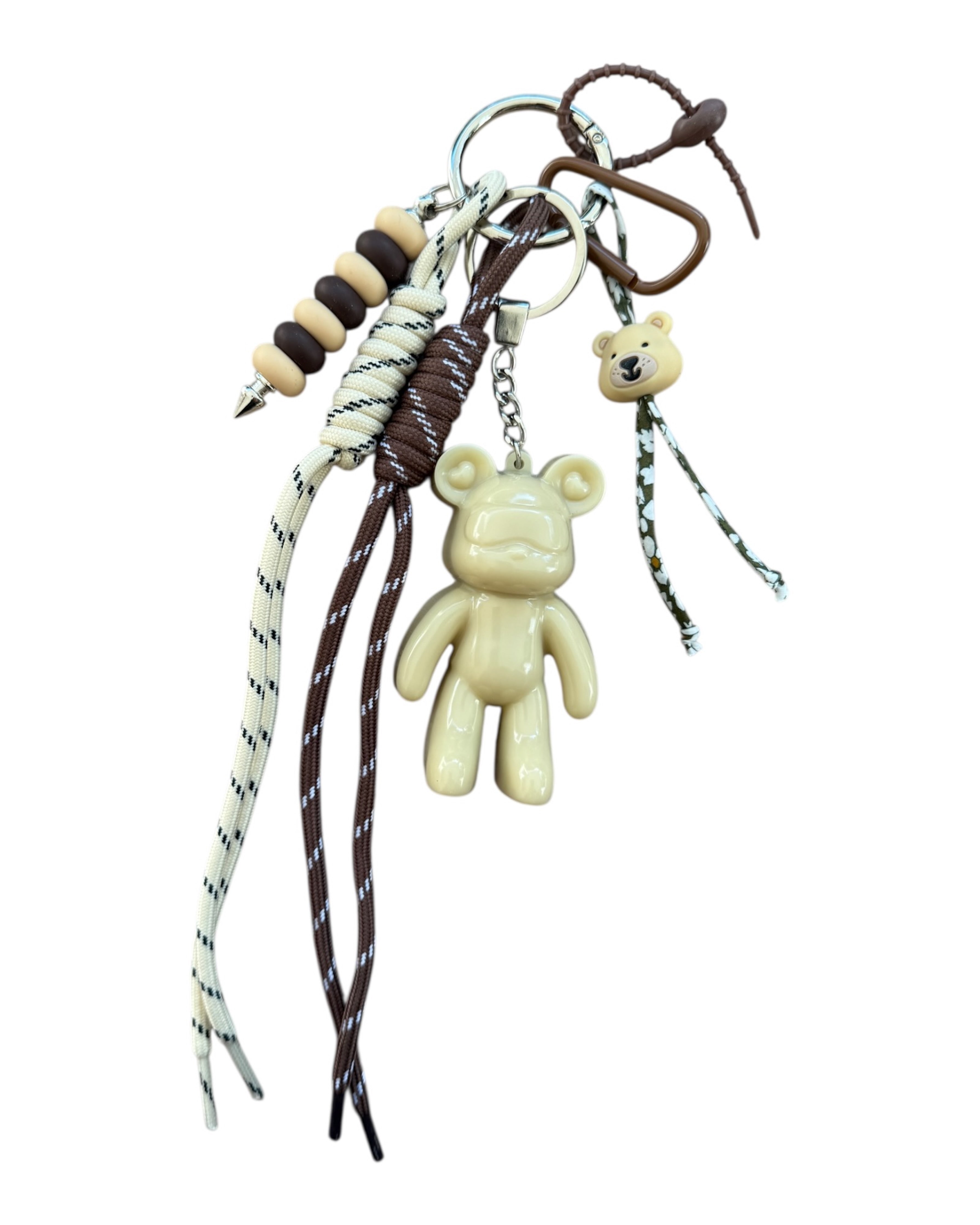 grigri de sac Urban Ted Sand Essence en résine époxy beige avec cordons marron et tons naturels