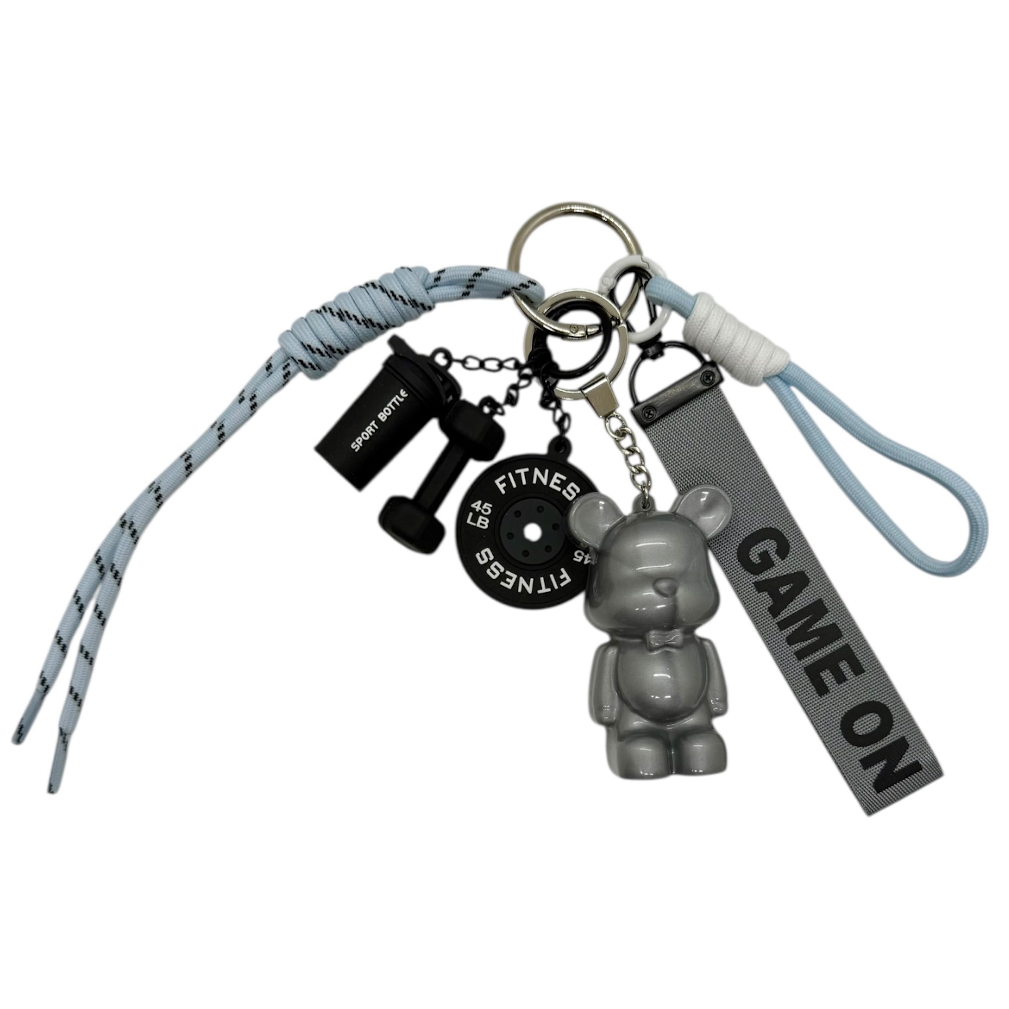 Grigri Game On avec Teddy’z gris métal et accessoires fitness, création artisanale énergique et urbaine.