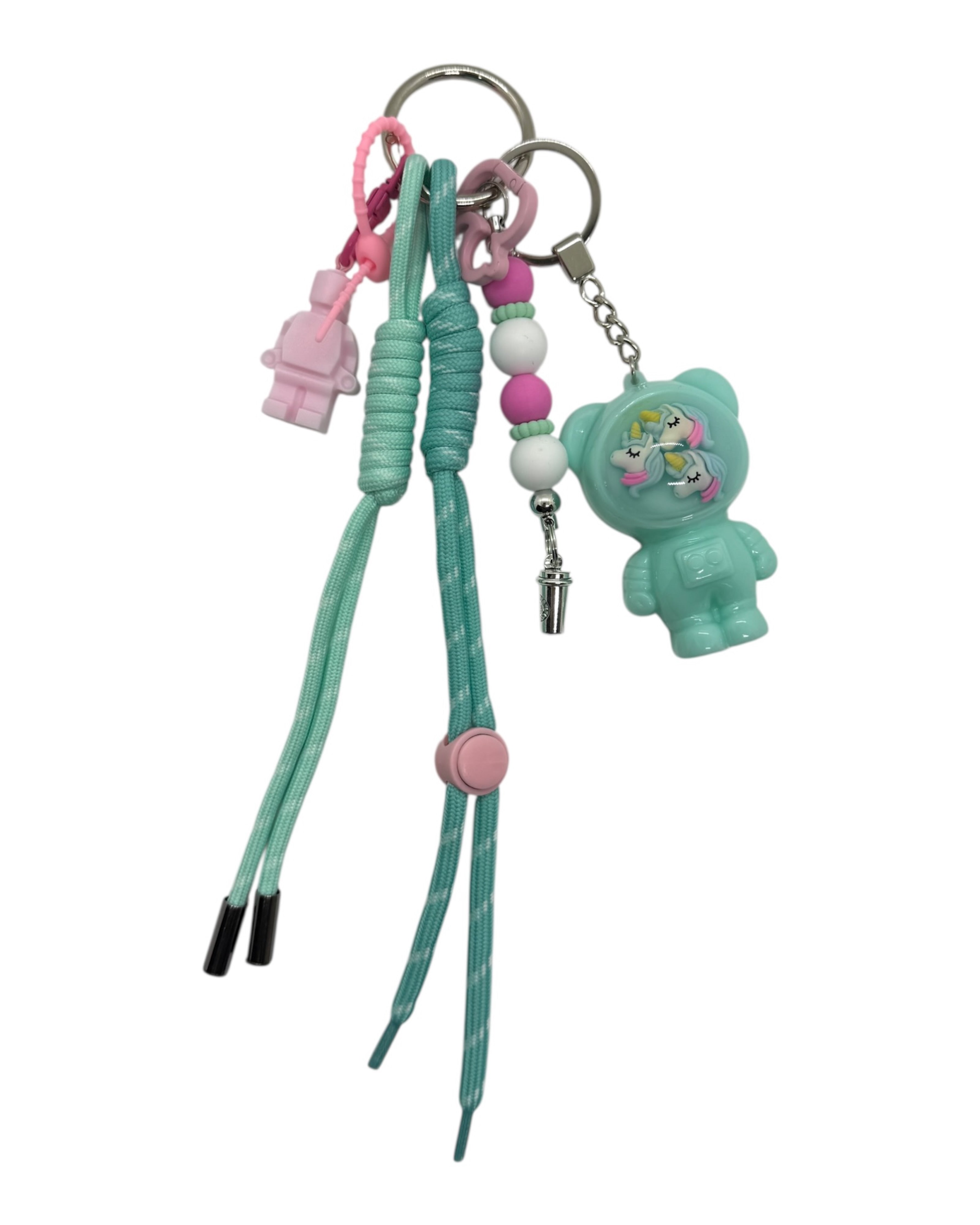 Grigri Izzy Lagoon Wish turquoise en resine epoxy, porte-cles licorne fait main, accessoire lumineux inspire des lagons et des reves d ete.