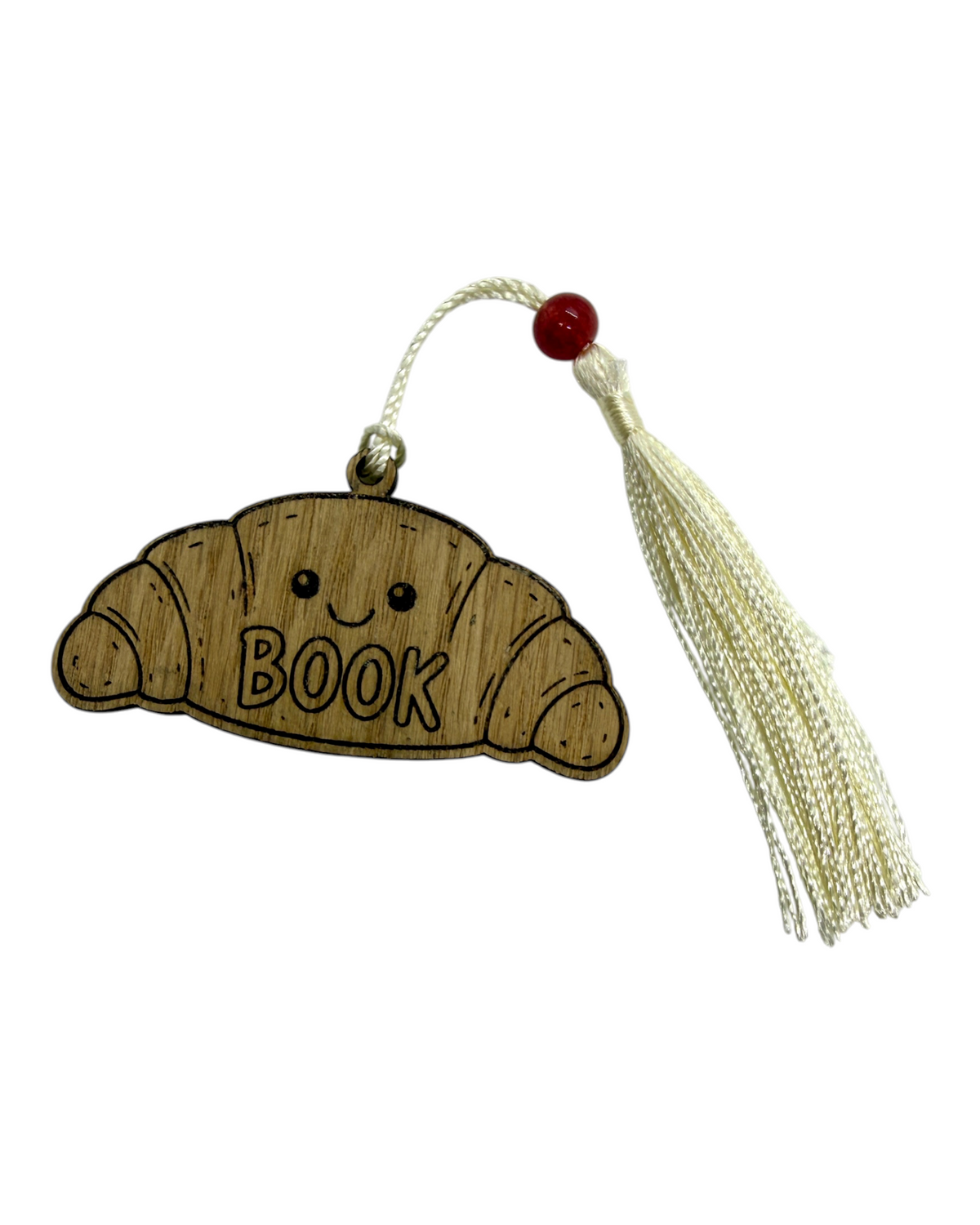 Little Croissant, marque-page en bois découpé et gravé au laser dans l’atelier Lolie’z avec pompon et perle.