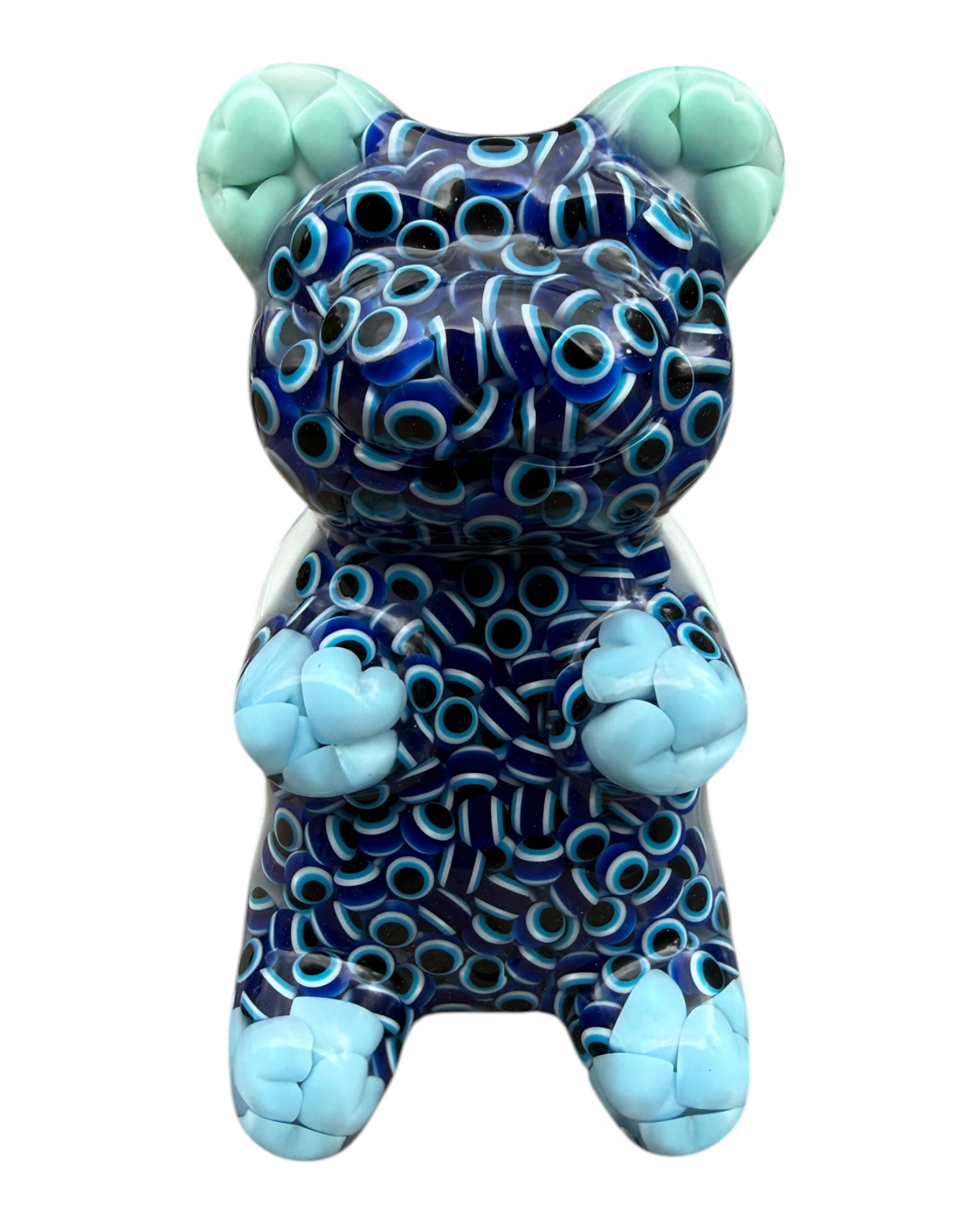 Figurine Gummy en résine époxy transparente avec motifs yeux bleus Nazar, vue de face, finition brillante et design décoratif unique.