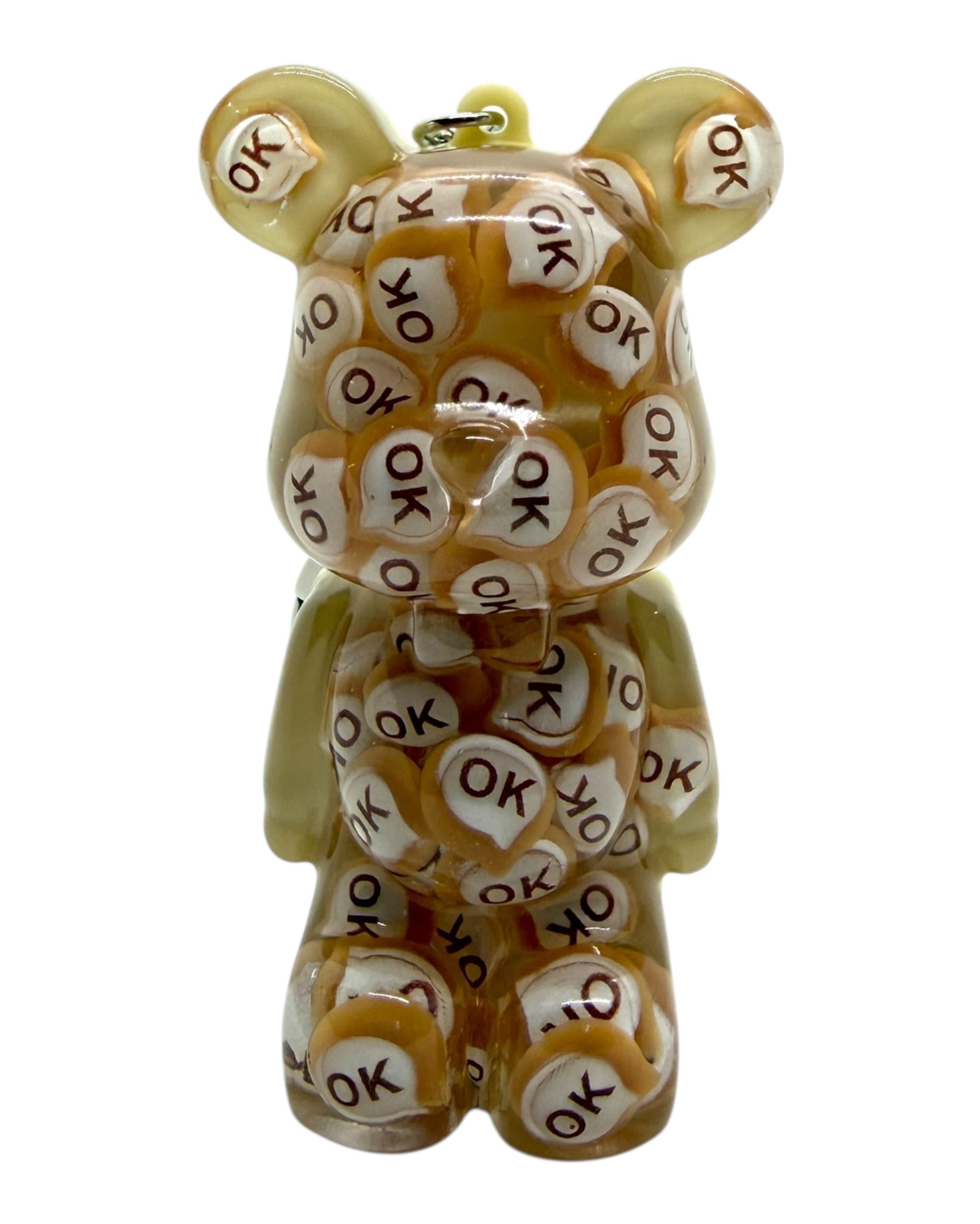 Ours Teddy’z Mister OK transparent aux nuances miel avec motifs OK intégrés.