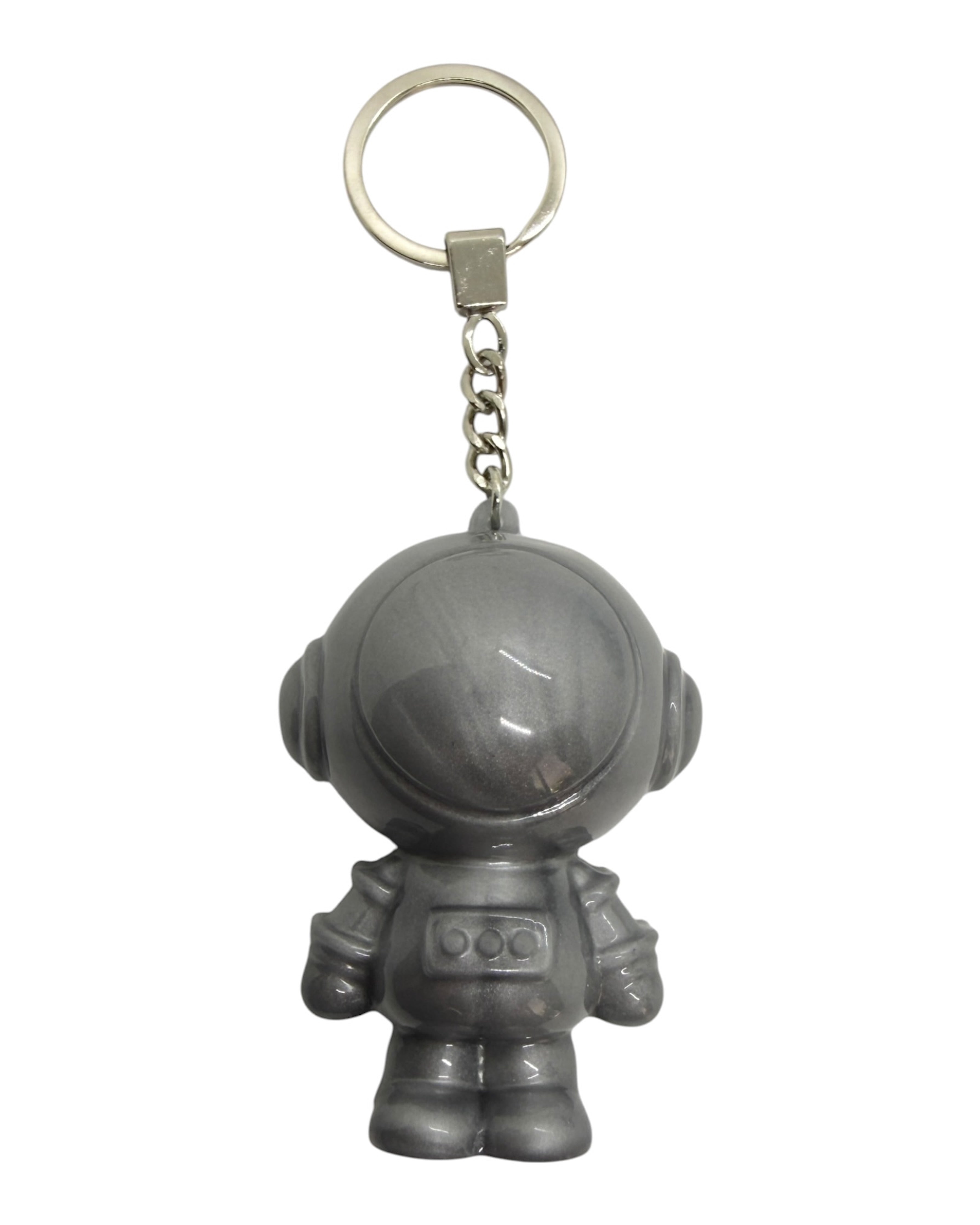 Astro Boy gris foncé fait main en résine époxy avec reflets métallisés et style cosmique.
