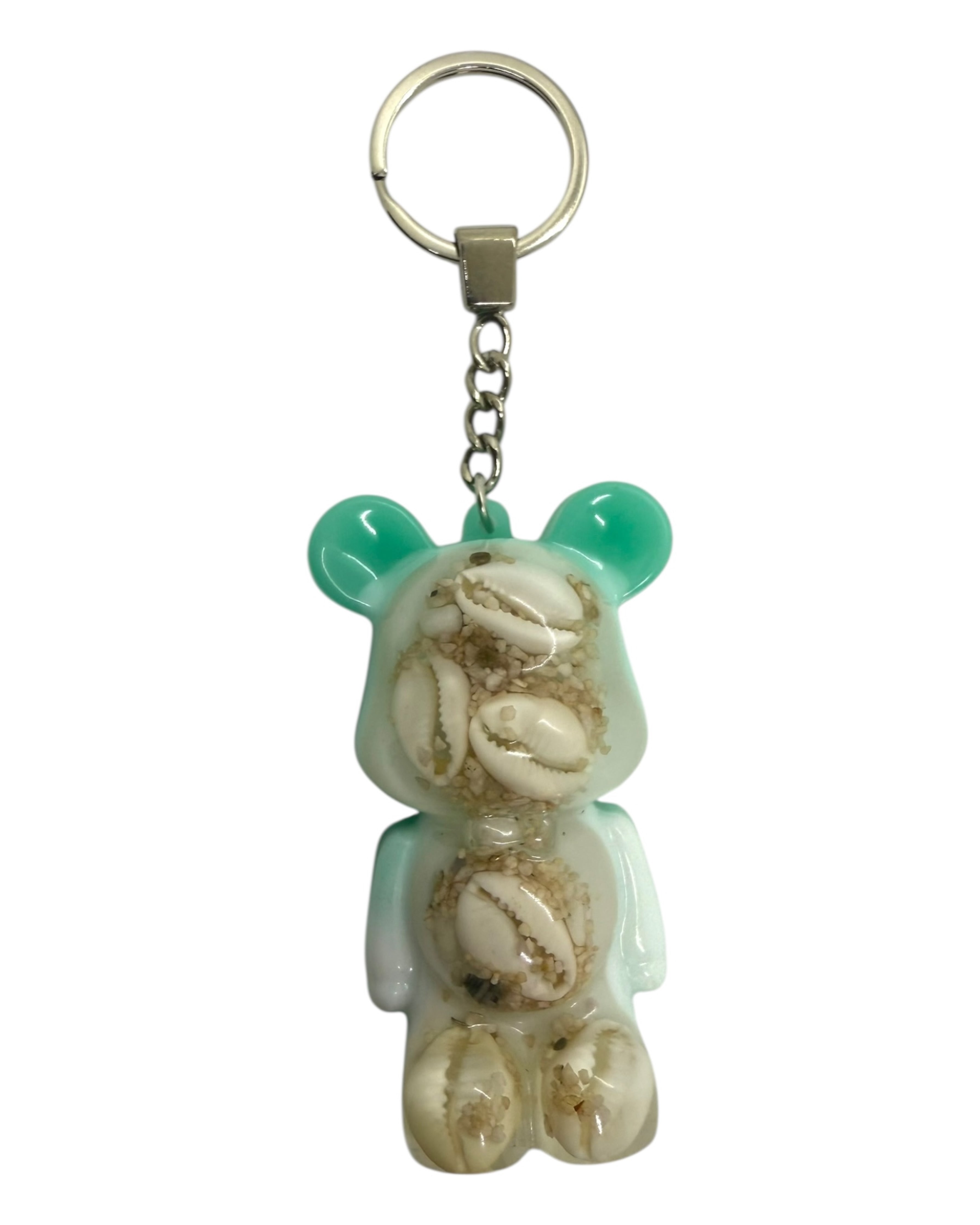 Ourson porte-clé en résine époxy avec coquillages, aux couleurs bleu lagon et blanc, style vacances.