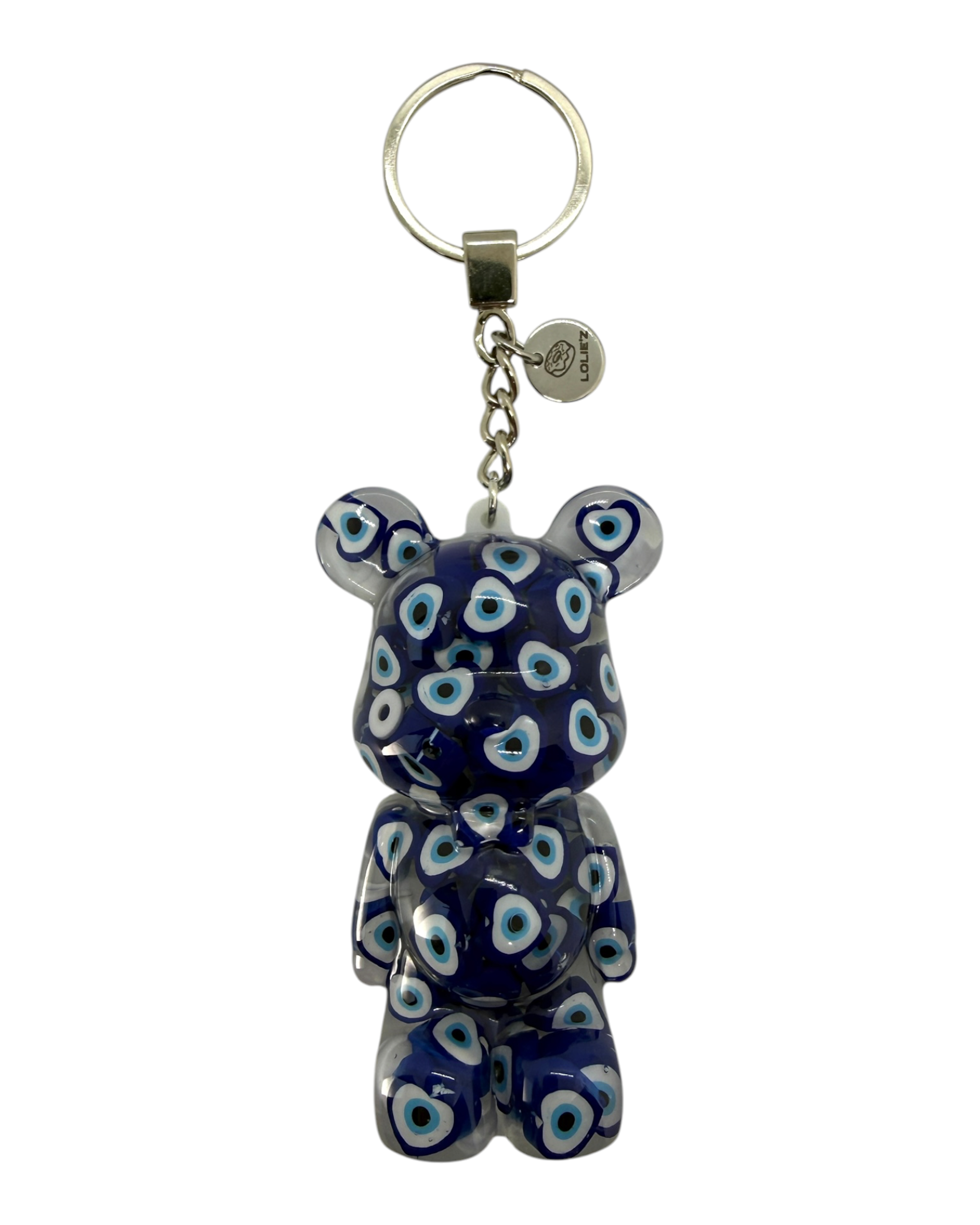 Porte-clés Teddy’z Talisman de Lolie’z, ours porte-bonheur fabriqué à la main en résine époxy avec détails symboliques et médaille gravée.