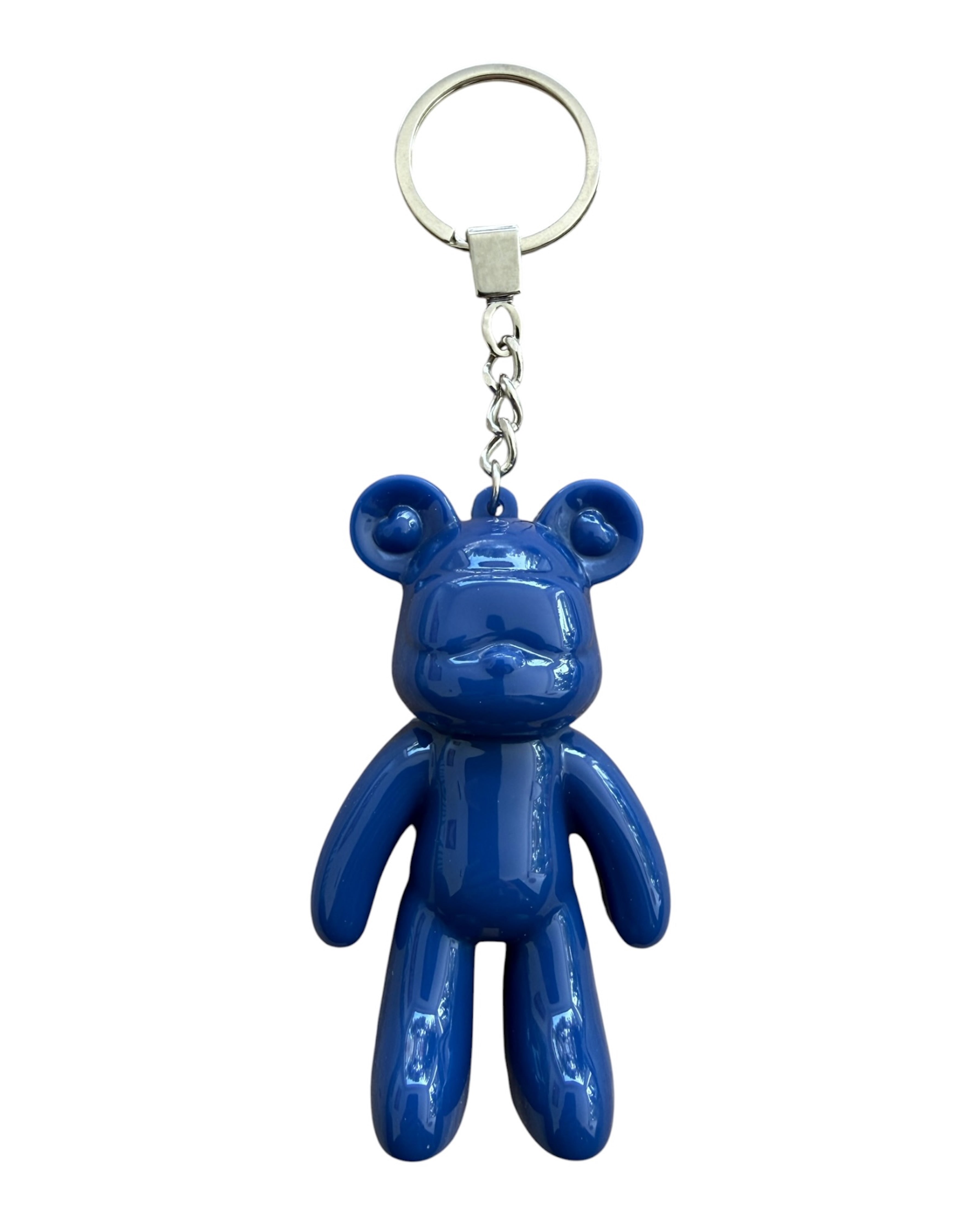 Porte-clé ours bleu glossy en résine époxy avec finition brillante dans une ambiance moderne et tendance.