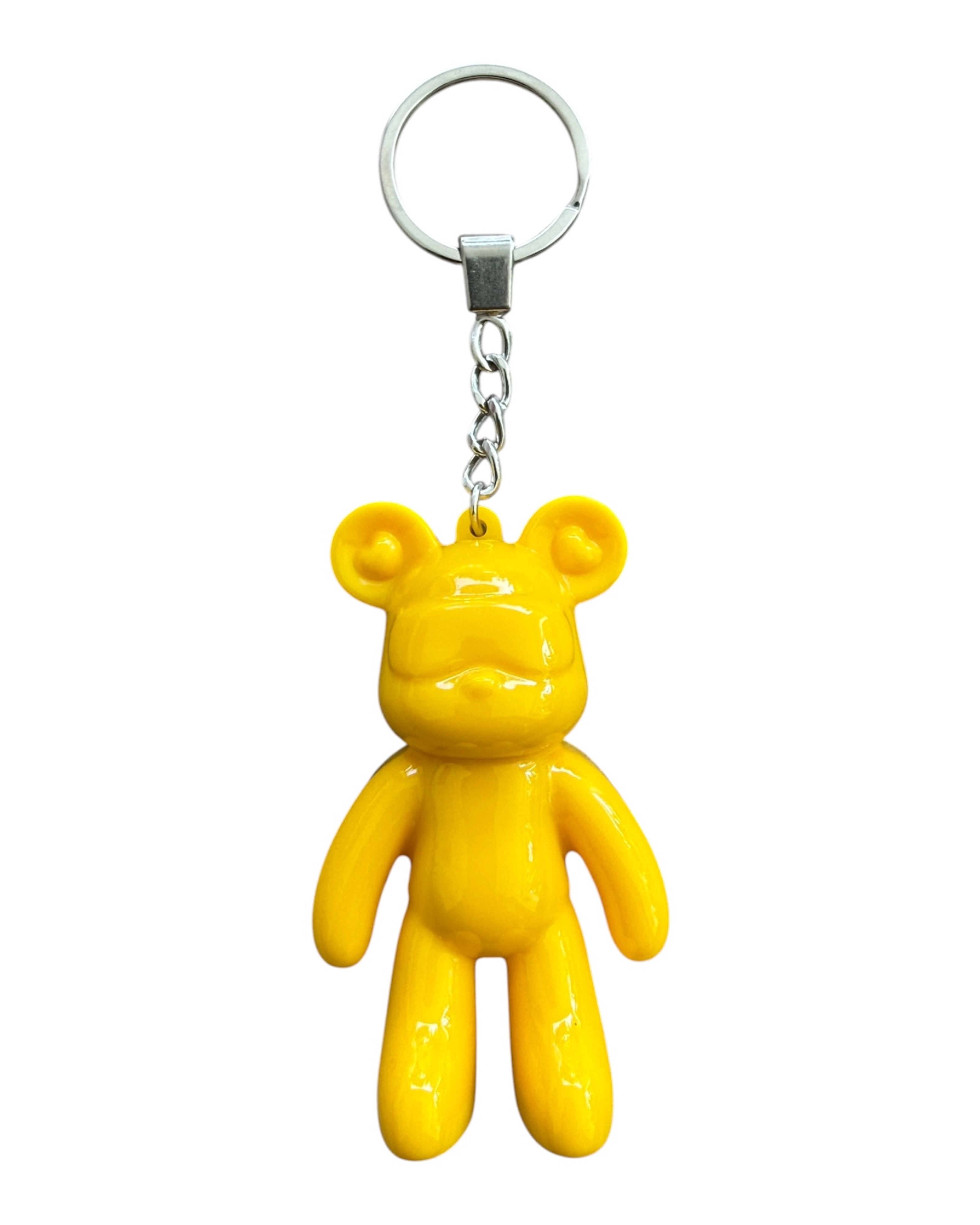 Porte-clé ours jaune glossy en résine époxy avec finition brillante dans un univers moderne et coloré.